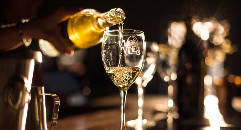 Pouring a glass of wine at Urban Vines in Westfield, IN