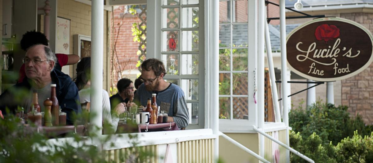 People dining on the outdoor patio at Lucile's Boulder