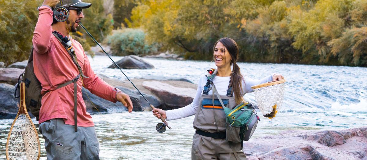 Two people fly fishing on Clear Creek in the fall