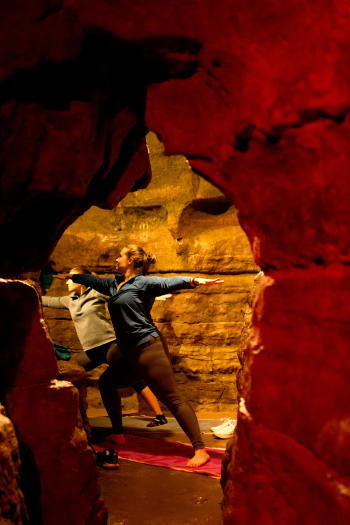 A women doing a yoga pose in Olentangy Caverns