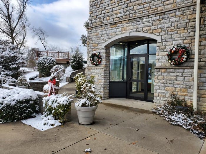 The entrance to the Behringer-Crawford Museum during winter with a dusting of snow.
