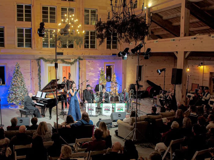 A singer performs on stage with a pianist for the season 11 Clayton Piano Festival Holiday Gala