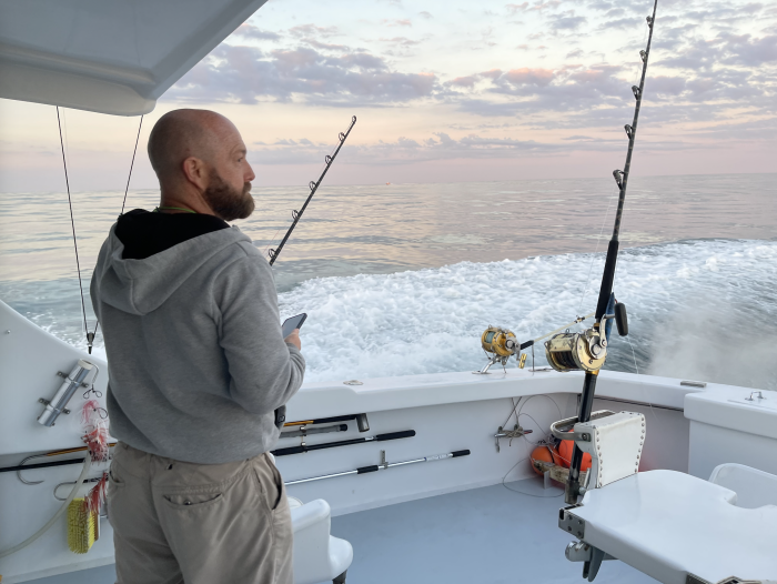 Man Tuna Fishing Off The Back Of A Charter Boat On The Outer Banks