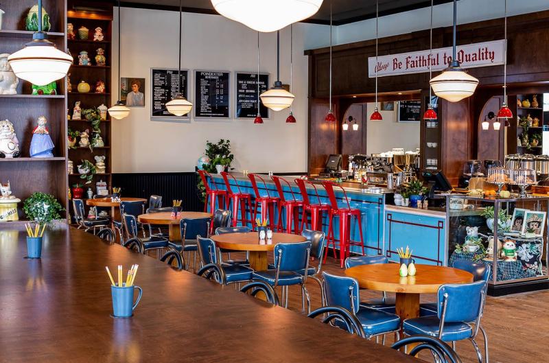 Interior tables and chairs at the Poindexter Cafe in the Graduate Hotel 