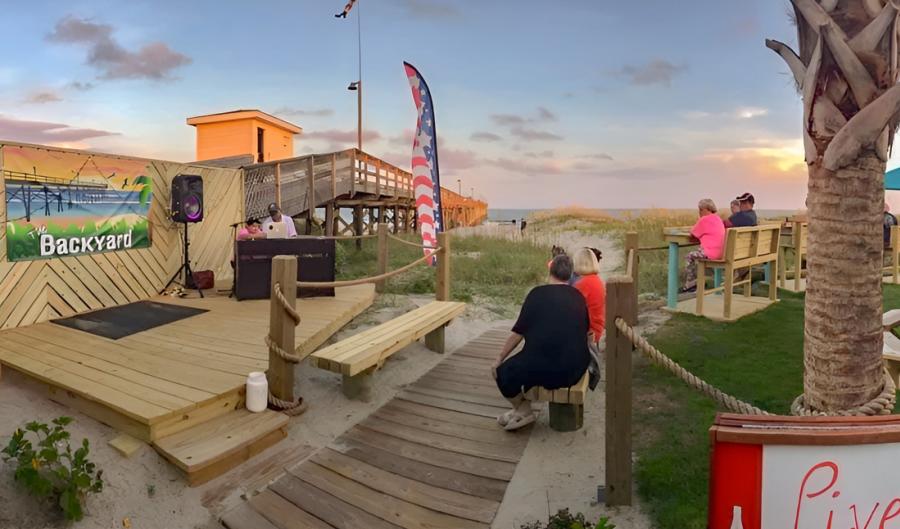 people listening to live music at the Ocean Isle Beach Pier