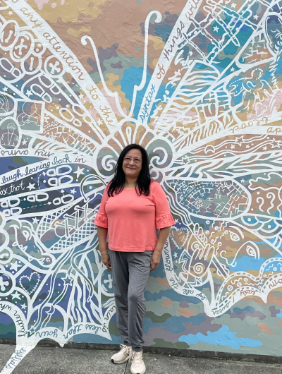 Woman standing in front of the butterfly mural in West Reading