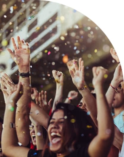 Fans cheering on their team at a sporting event.