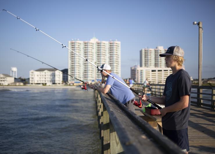 Fishermen cast a line over the side of the Cherry Grove Pier in North Myrtle Beach.