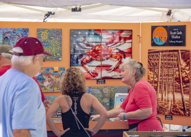 Festival goers admire vendor exhibits