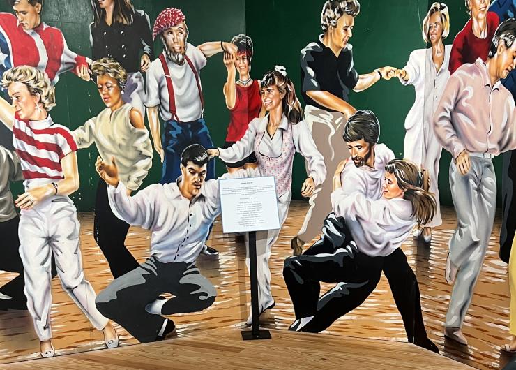 A painting of people in 60's garb, dancing on a dance floor.