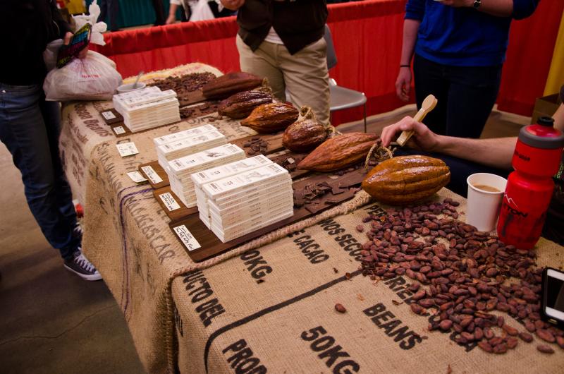 Bars of chocolate and cacao beans on a table at the Southwest Chocolate and Coffee Festival.