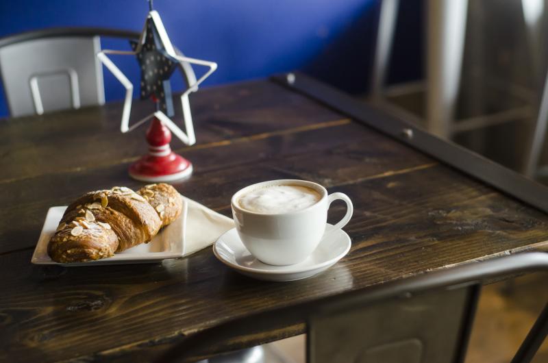 Coffee and a pastry on a table at a restaurant