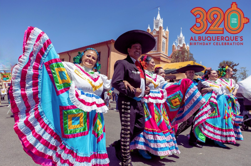 Dancers stand in front of San Felipe de Neri in a photo promoting Albuquerque's 320th birthday.