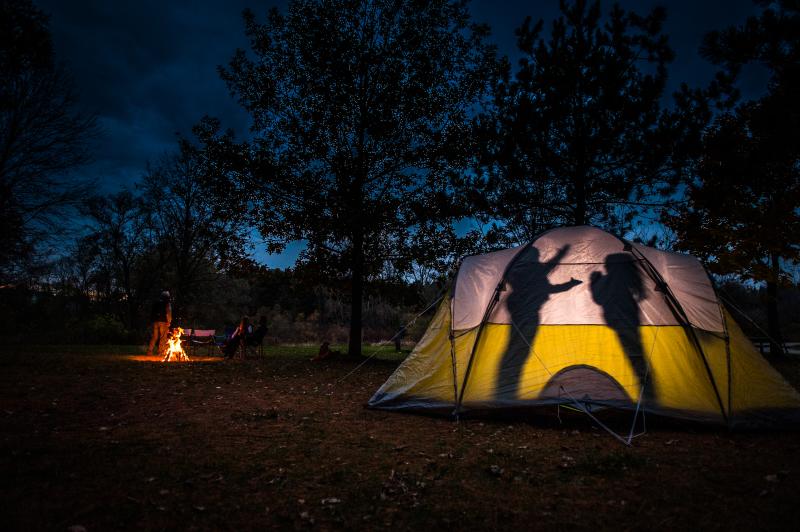 Camping beside campfire