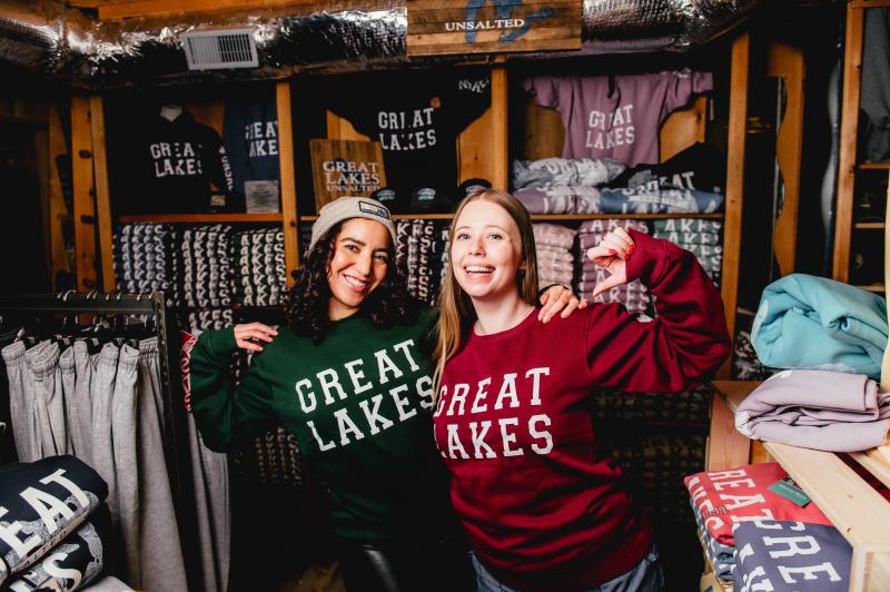 two women wearing great lakes shirts looking at camera