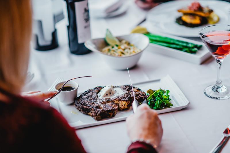 woman eating steak