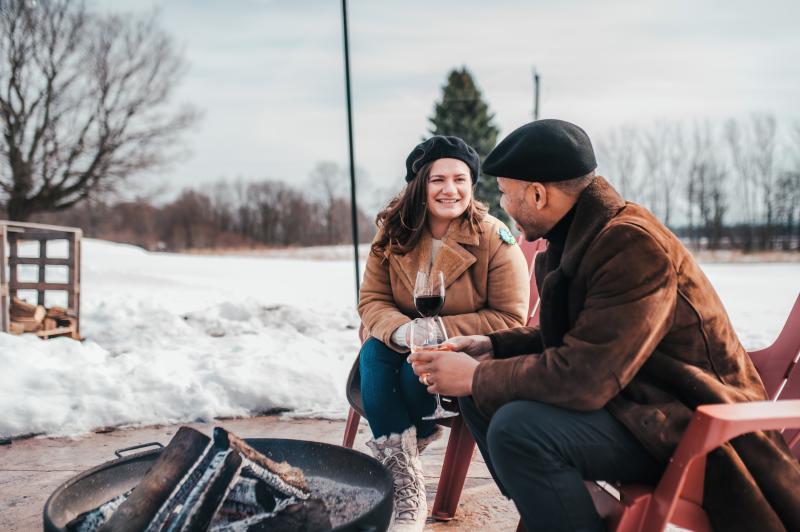 couple by fire at winery