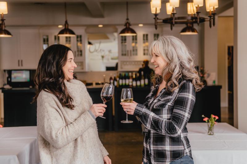 Two women cheers wine