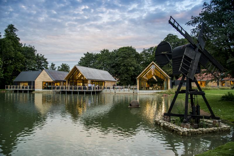 Weald & Downland Museum lake with wooden buildings