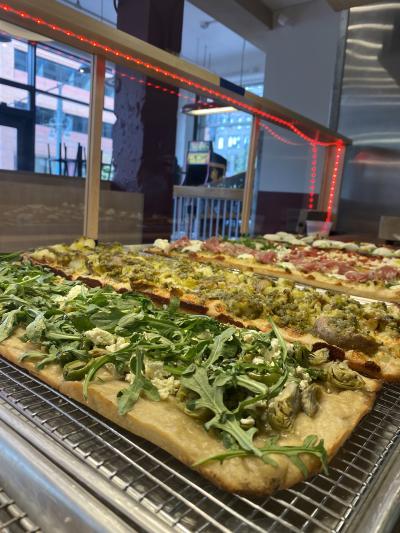 Three different kinds of pizza at Eat'Ya Pizza in Denver, Colorado