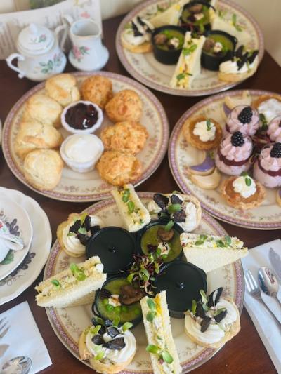 Table full of tea time food at Lanier House