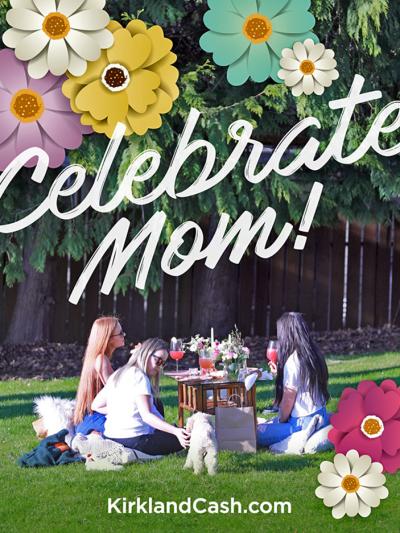 Three ladies sit at an elaborate outdoor picnic with the words "Celebrate Mom" on the photo.