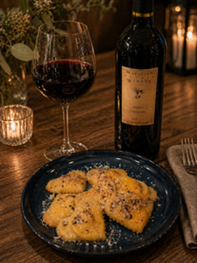 Plated ravioli with a glass of red wine