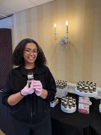 Nasim holding dessert