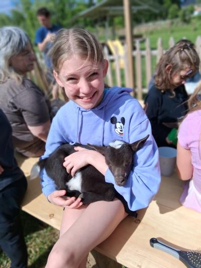 White Clover Farm goat snuggling