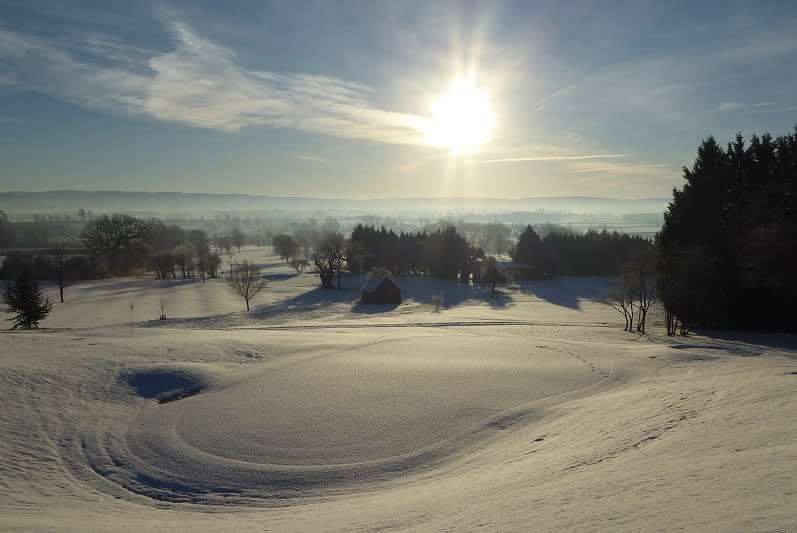 The golf course at Tewkesbury Park dusted in snow and glinting in the winter sun