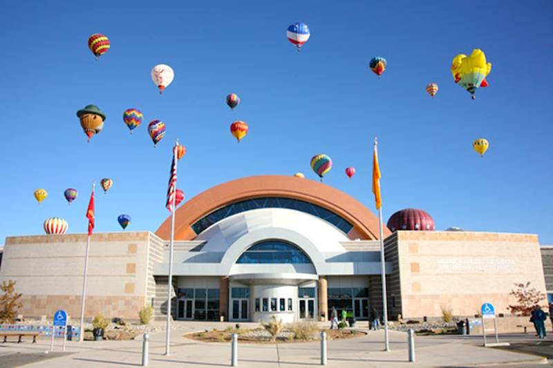 Balloons float over the Anderson Abruzzo Albuquerque International Balloon Museum during the Albuquerque International Balloon Fiesta