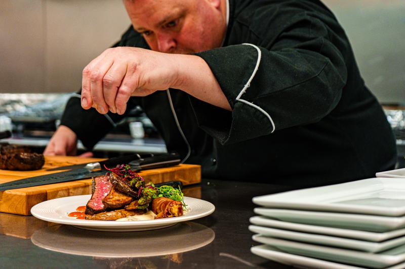 Executive Chef James Hice makes the final touches on a dish at the Albuquerque Convention Center
