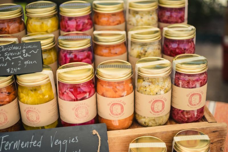 Rows of pickled vegetables sit on shelves at the Fermentation and Fungi Fest.