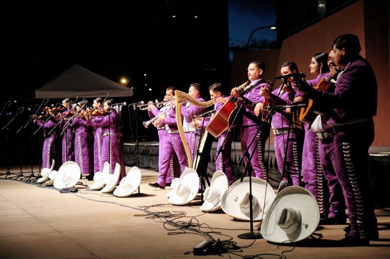 A mariachi group performs.