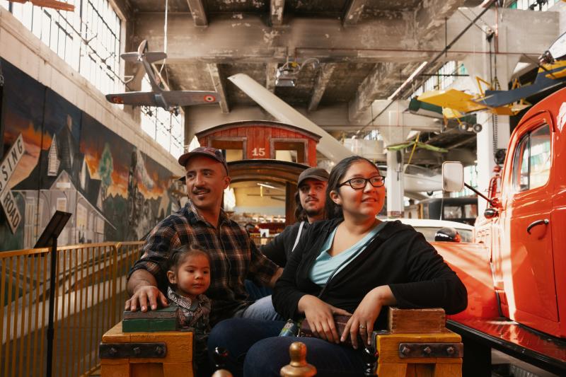 A family enjoys the Wheels Museum in Albuquerque.