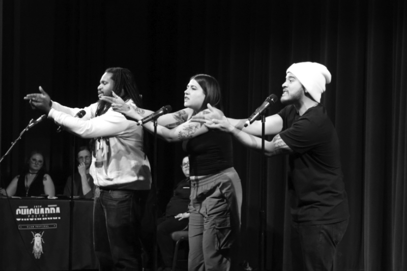 Three people perform a poetry piece at the Chicharra Poetry Festival.