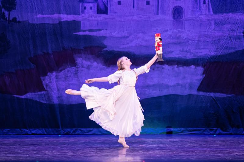 Clara dances with the nutcracker during a performance of The Nutcracker at Popejoy Hall