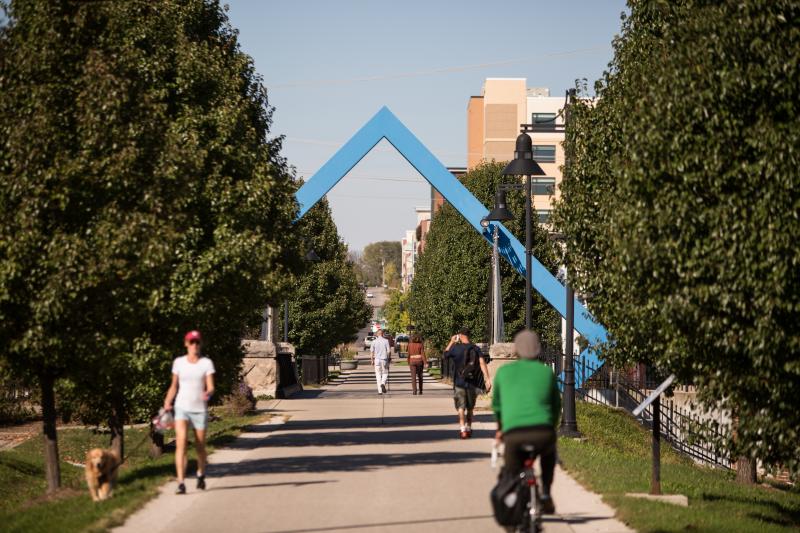 People walking and biking on the B-Line Trail during summer