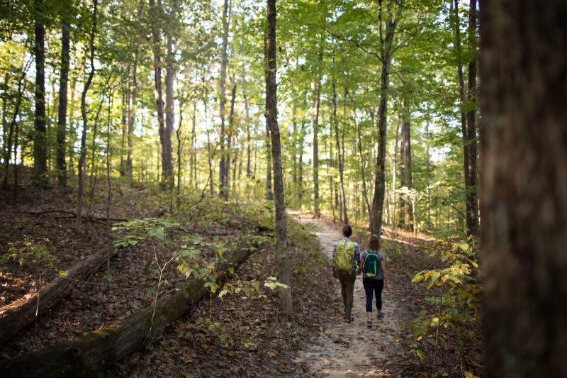 Two people hiking at Monroe Lake