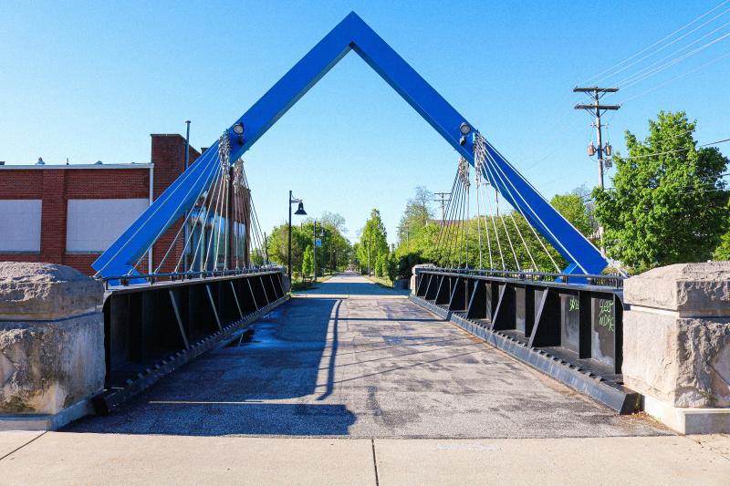 A shot of the B-Line Trail's blue-arched bridge during spring