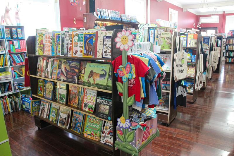 A section of children's books and other items at Book Corner