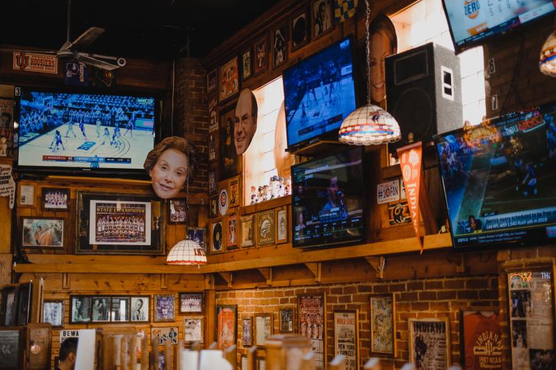 Walls lined with TVs and sports memorabilia at BuffaLouie's