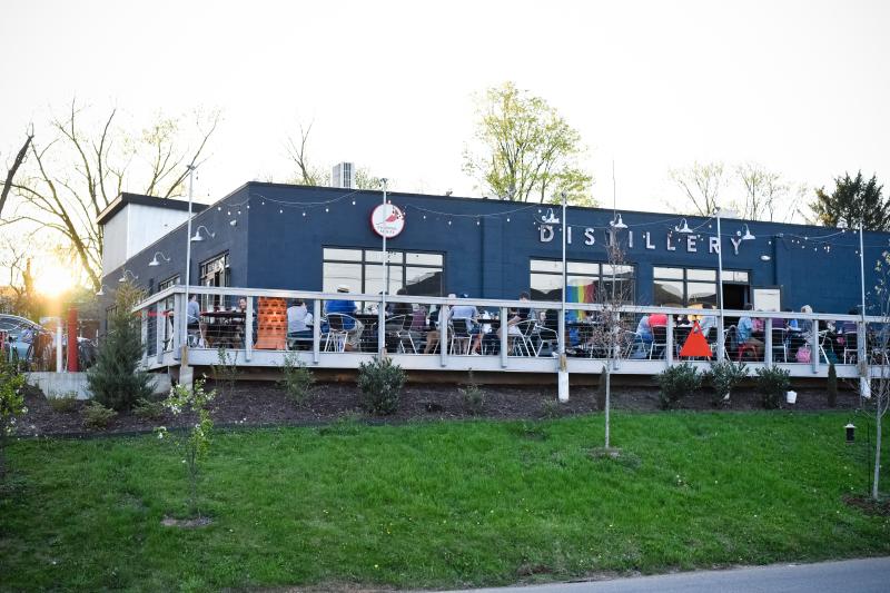 A shot of people dining on the patio at Cardinal Spirits