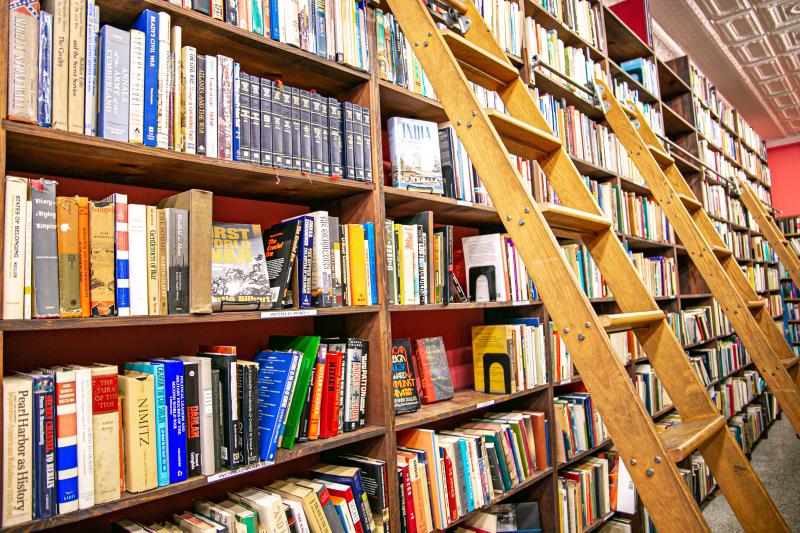 Ladder aisle to the book shelves at Caveat Emptor Used Books