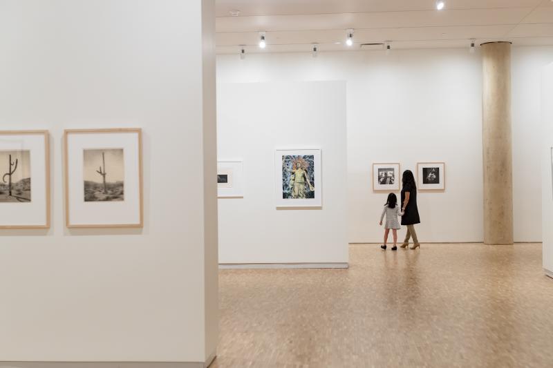 A mother and daughter observing art at the Eskenazi Museum of Art