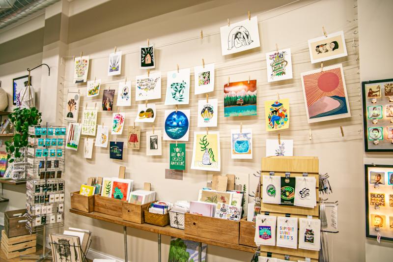 Display of wall art and prints at Gather Handmade Shoppe