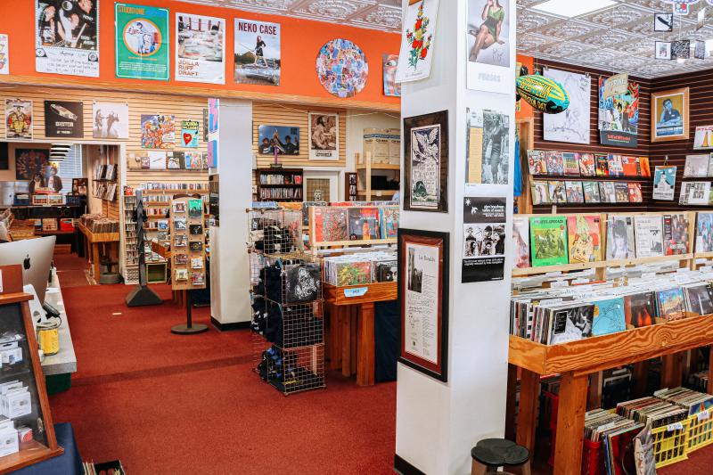 Displays of vinyl records and posters at Landlocked Music