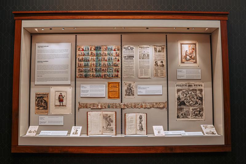 A display of old newspapers and books at the Lilly Library