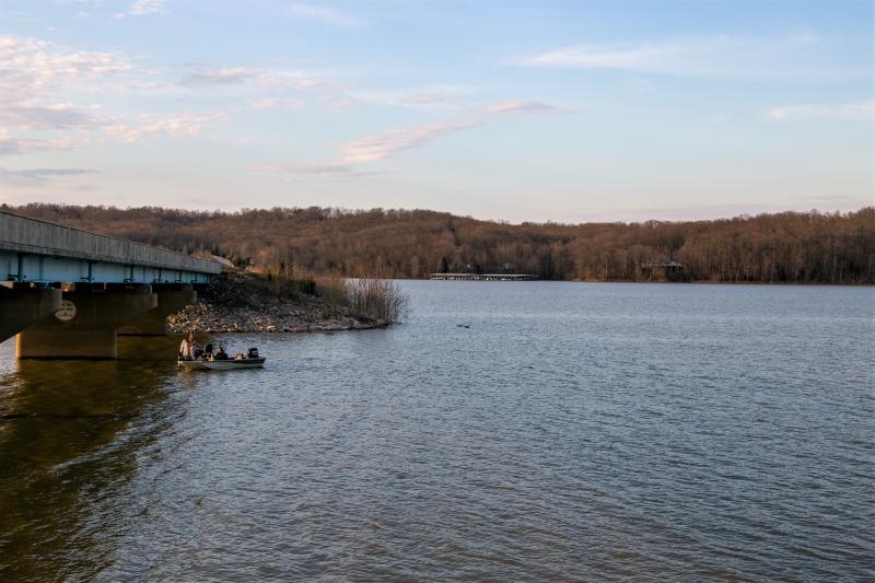 A small fishing boat on Monroe Lake at springtime