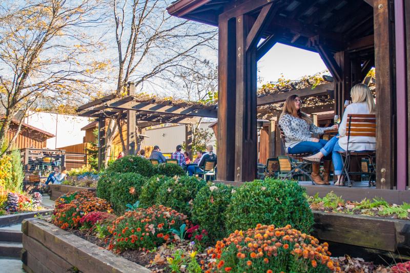 People Enjoying Outdoor Seating At Oliver Winery In Bloomington, IN